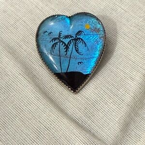 Vintage brooch featuring a Blue Morpho butterfly wing background marked Myrtle